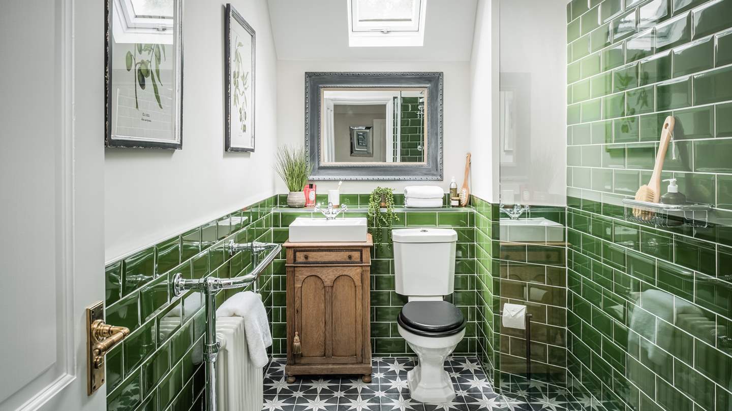 The fabulous family shower room - we just love the green tiles!