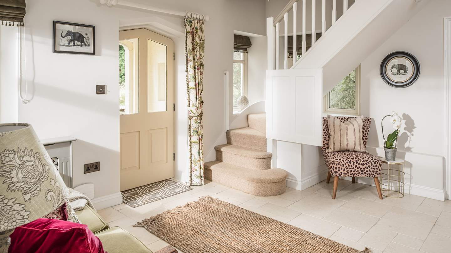 The pretty entrance hall, with stairs leading up to the bedrooms