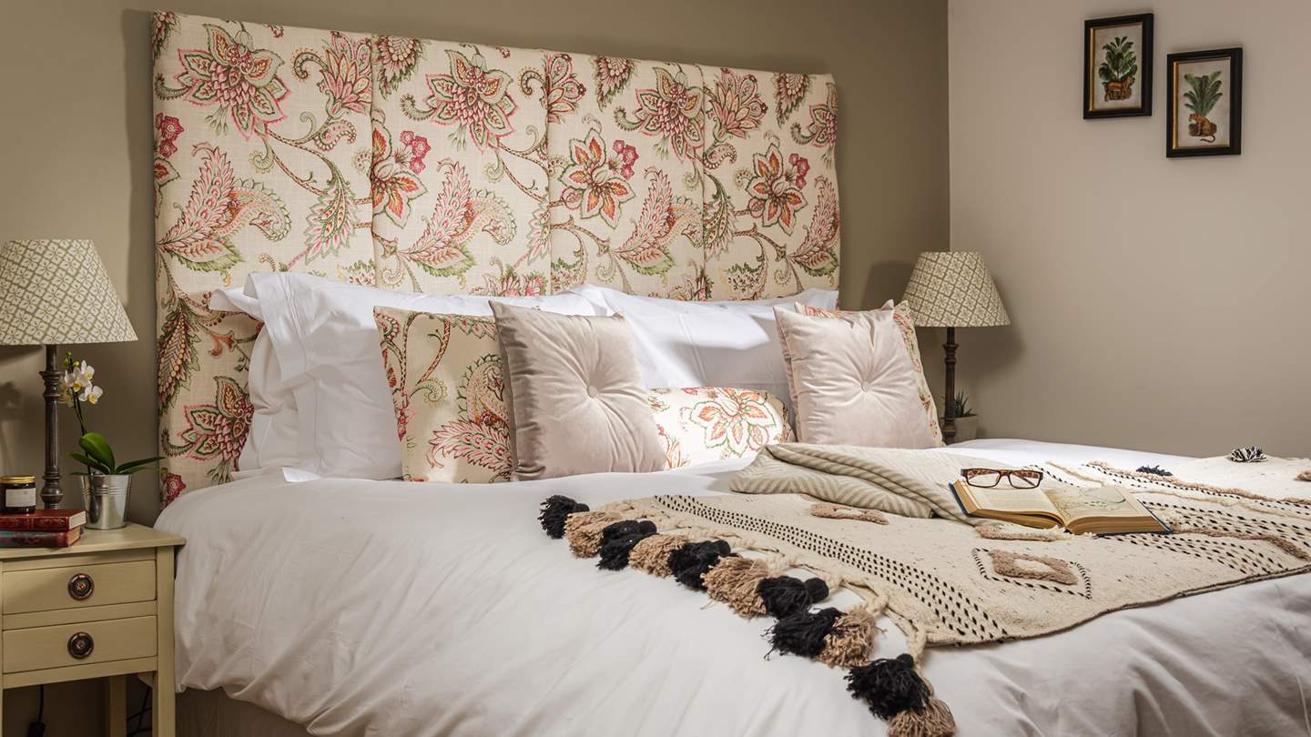 We just love the delicate floral theme throughout this bedroom...