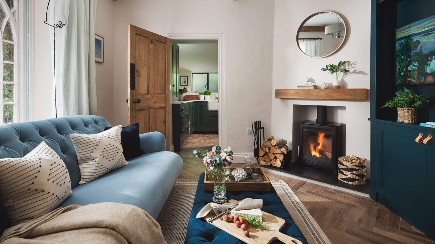 The stunning sitting room, the perfect spot to curl up together and watch the cosy wood burner
