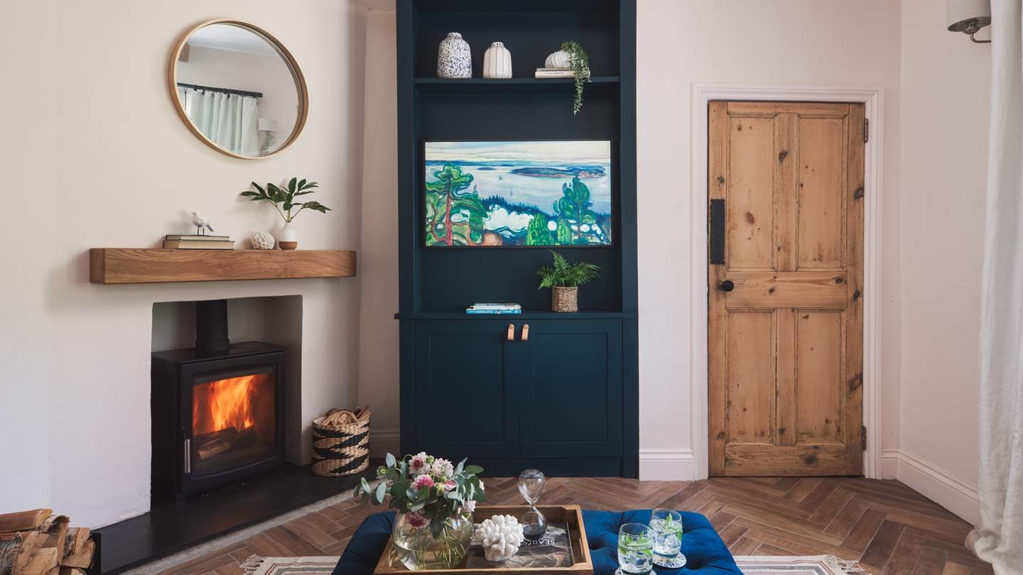 The delicious light of a flickering wood burner is oh-so-welcoming