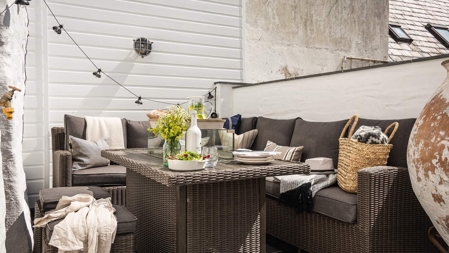 The sunny courtyard garden is the perfect spot for drinks and a laid back lunch