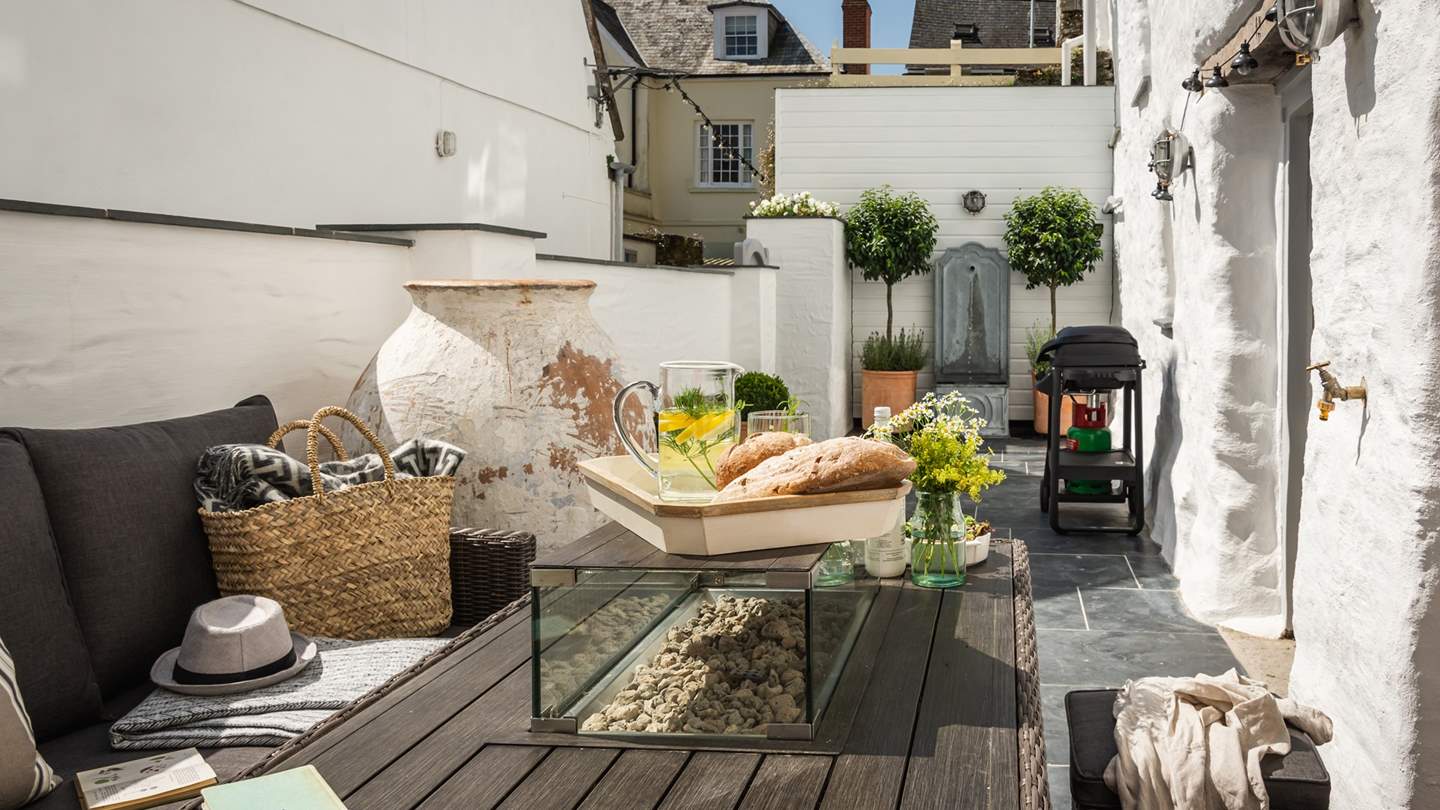 Outside, the fabulous courtyard garden is a magical hidden away paradise
