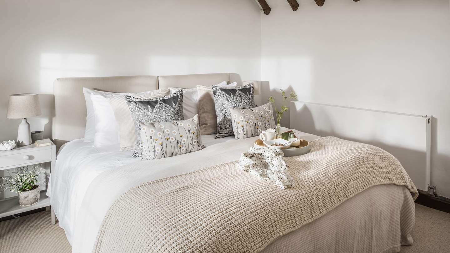 The second bedroom has a delightful super king-sized zip and link bed meaning it can also be made into twin beds