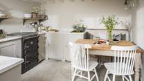 The cosy country kitchen complete with dining table