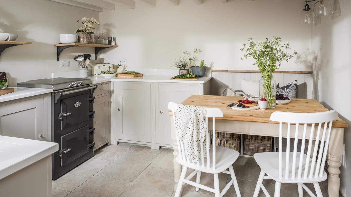The cosy country kitchen complete with dining table