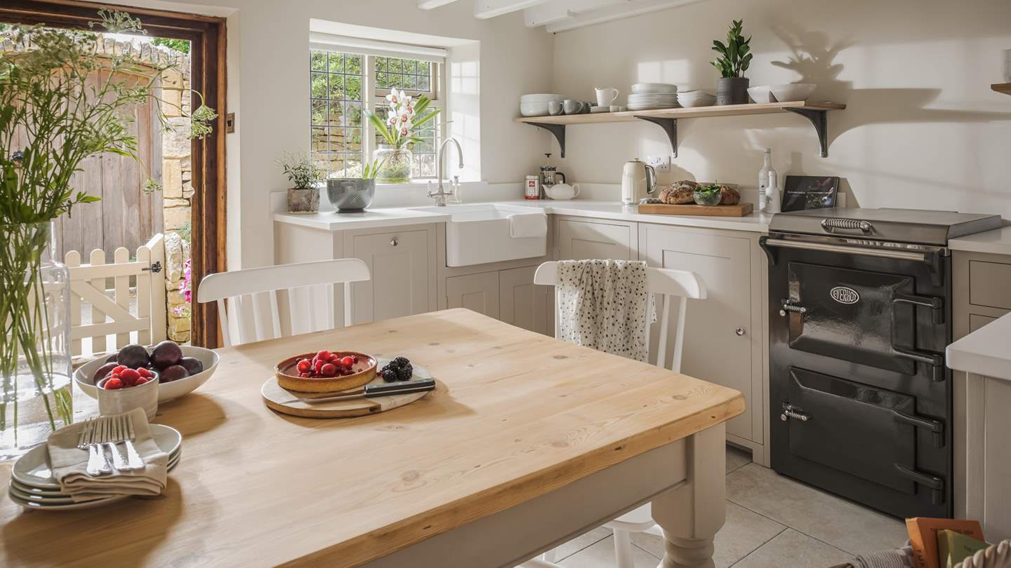 Cooking is a dream in the wonderful country kitchen, with pristine white quartz worktops, Belfast sink, and dove grey cupboards