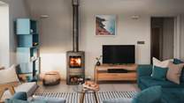 Cosy up in front of the handsome wood-burner on the sumptuous sofas dressed in a soothing shade of blue 