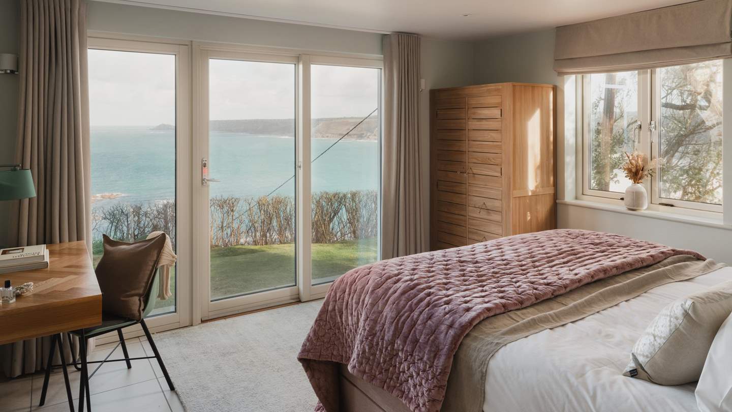 Dressed in shades of plush pink with cloud soft linens for a restful nights repose 