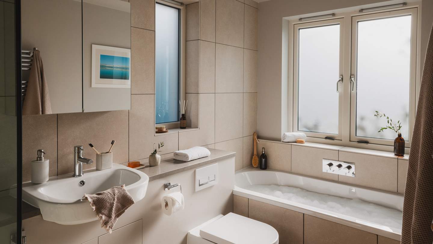 A large modern family bathroom can be found on the ground floor 