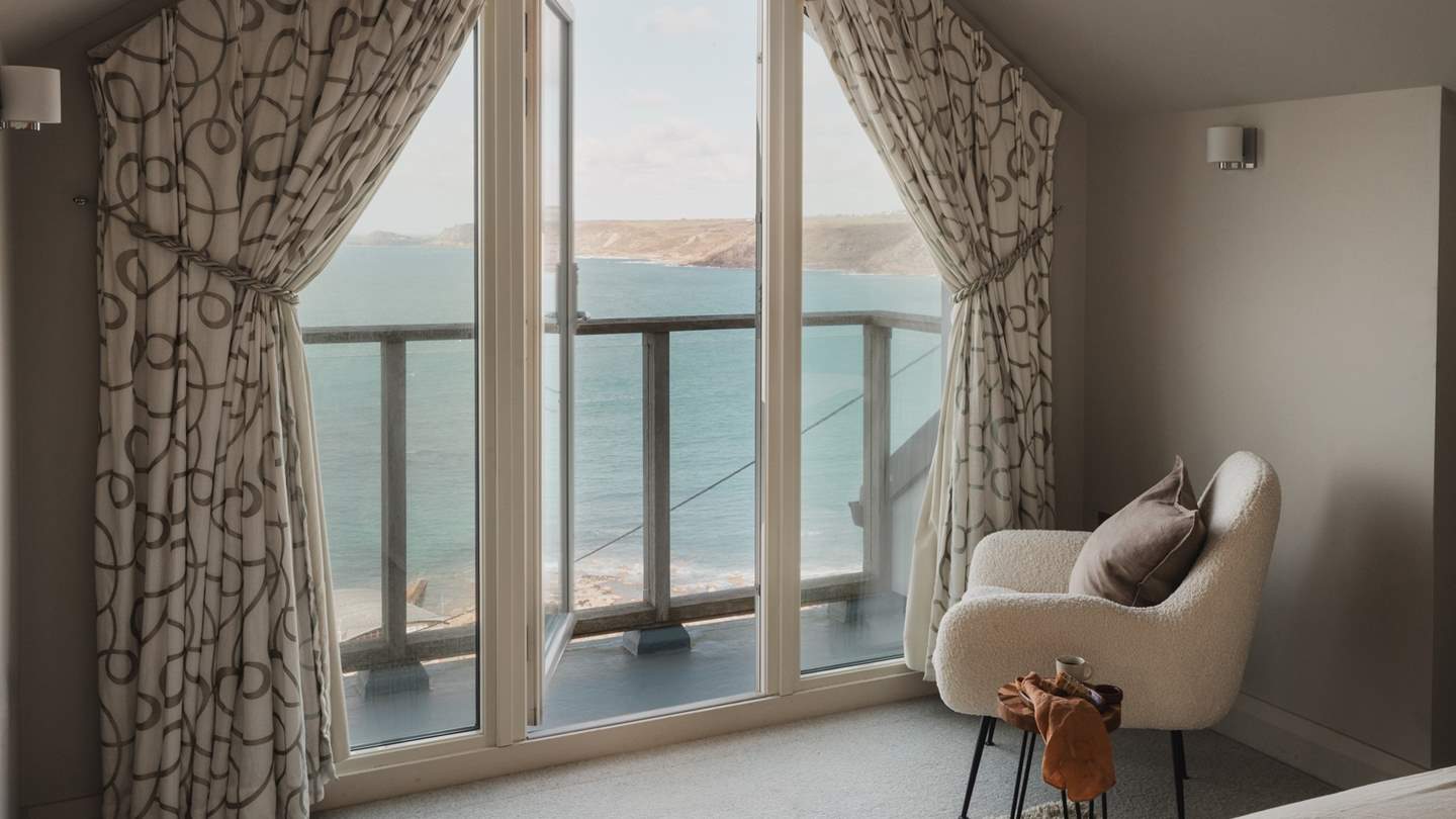 French doors lead out from here to a decked balcony which overlooks Sennen Cove, with beautiful views over towards Cape Cornwall

