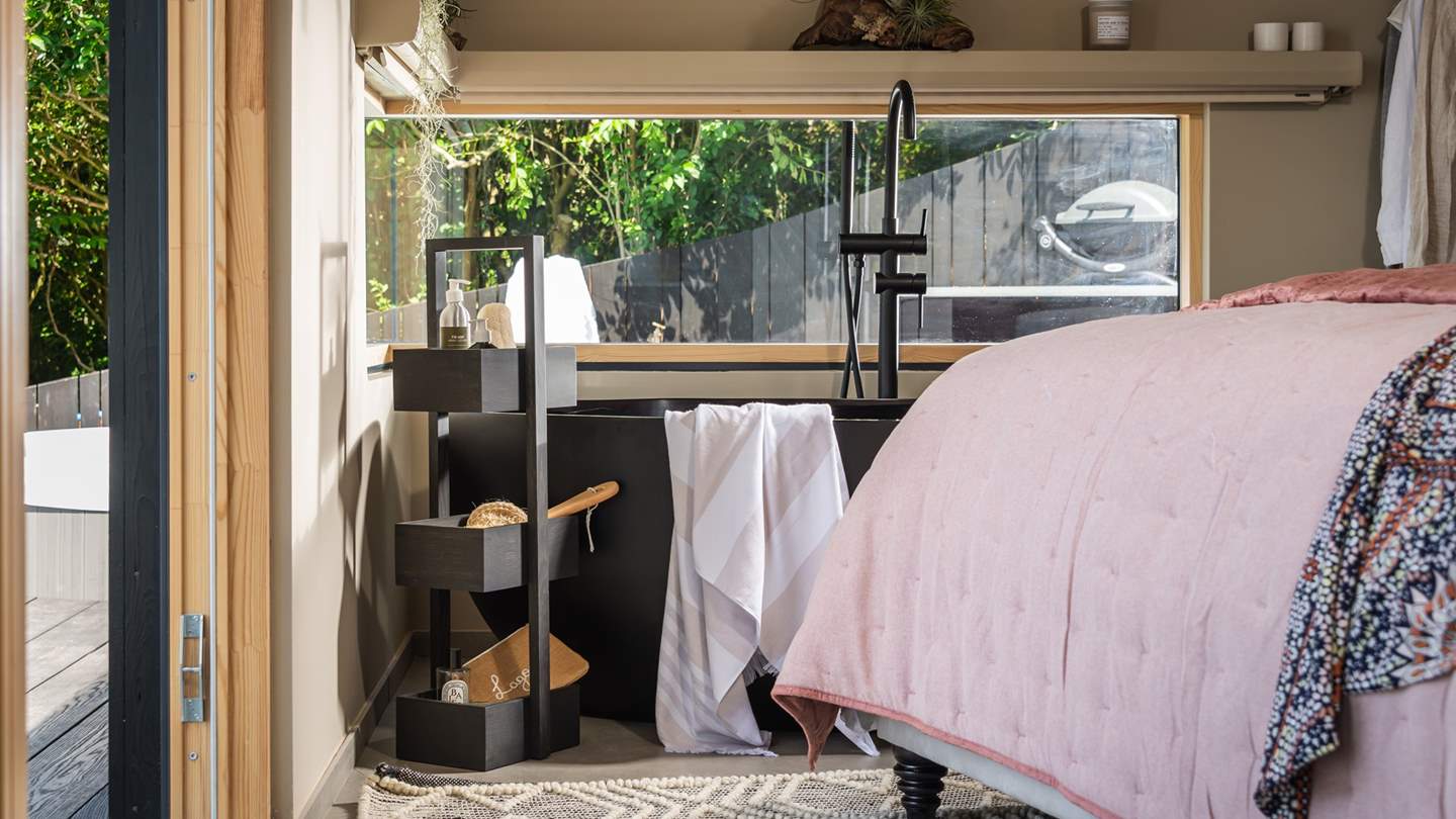 The pièce de resistance of this gorgeous space is the vast Lusso stone charcoal-black bath...