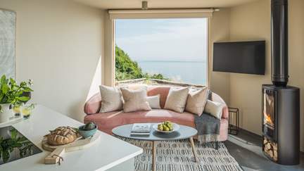 Fika offers an awe-inspiring clifftop position through the double aspect, full height picture window, featuring glorious views out towards Rame Head.