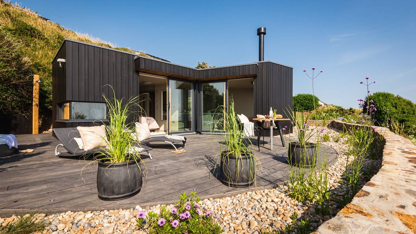 Striking blues and whites of the agapanthus, verbena and lavender nestle against the pebbles which surround Fika, dotted with succulents and ornamental grasses which catch in the breeze beautifully. 