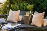 Relish seclusion with luxurious sun-loungers, outdoor chairs, a side table and bistro table for al fresco dining...