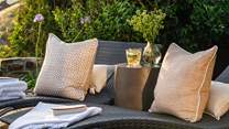 Relish seclusion with luxurious sun-loungers, outdoor chairs, a side table and bistro table for al fresco dining...