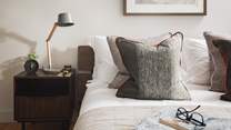 Bedside tables offer lovely reading lamps, just perfect for slow mornings and lingering lie ins...