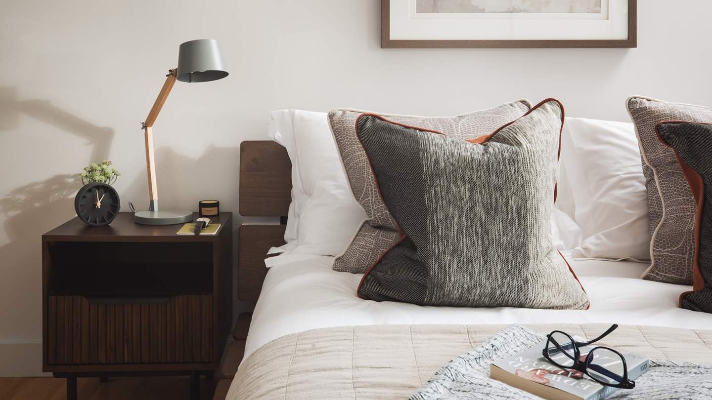 Bedside tables offer lovely reading lamps, just perfect for slow mornings and lingering lie ins...