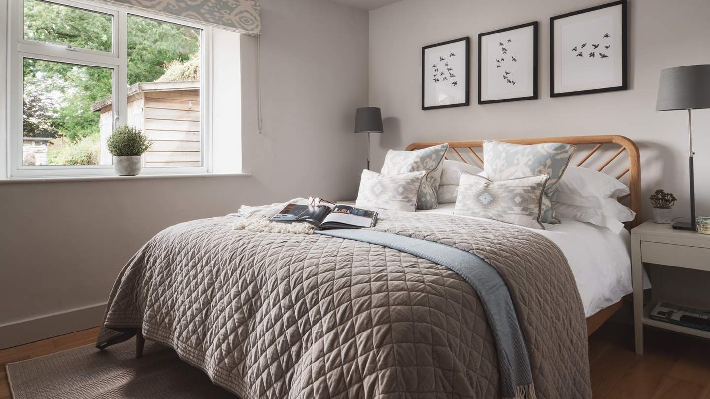 Bedroom three is adorned in soothing shades and offering stunning Creekside views, seek sanctuary in this dreamy space.