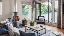 Settle in beside the wood burning stove for uninterrupted views over the water...