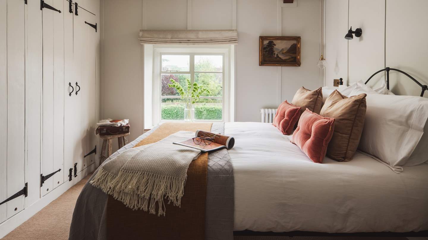The gorgeous master bedroom has lots of in-built wardrobes for storage