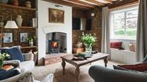 The sumptuous sitting room, a dreamy delight with wood burning stove