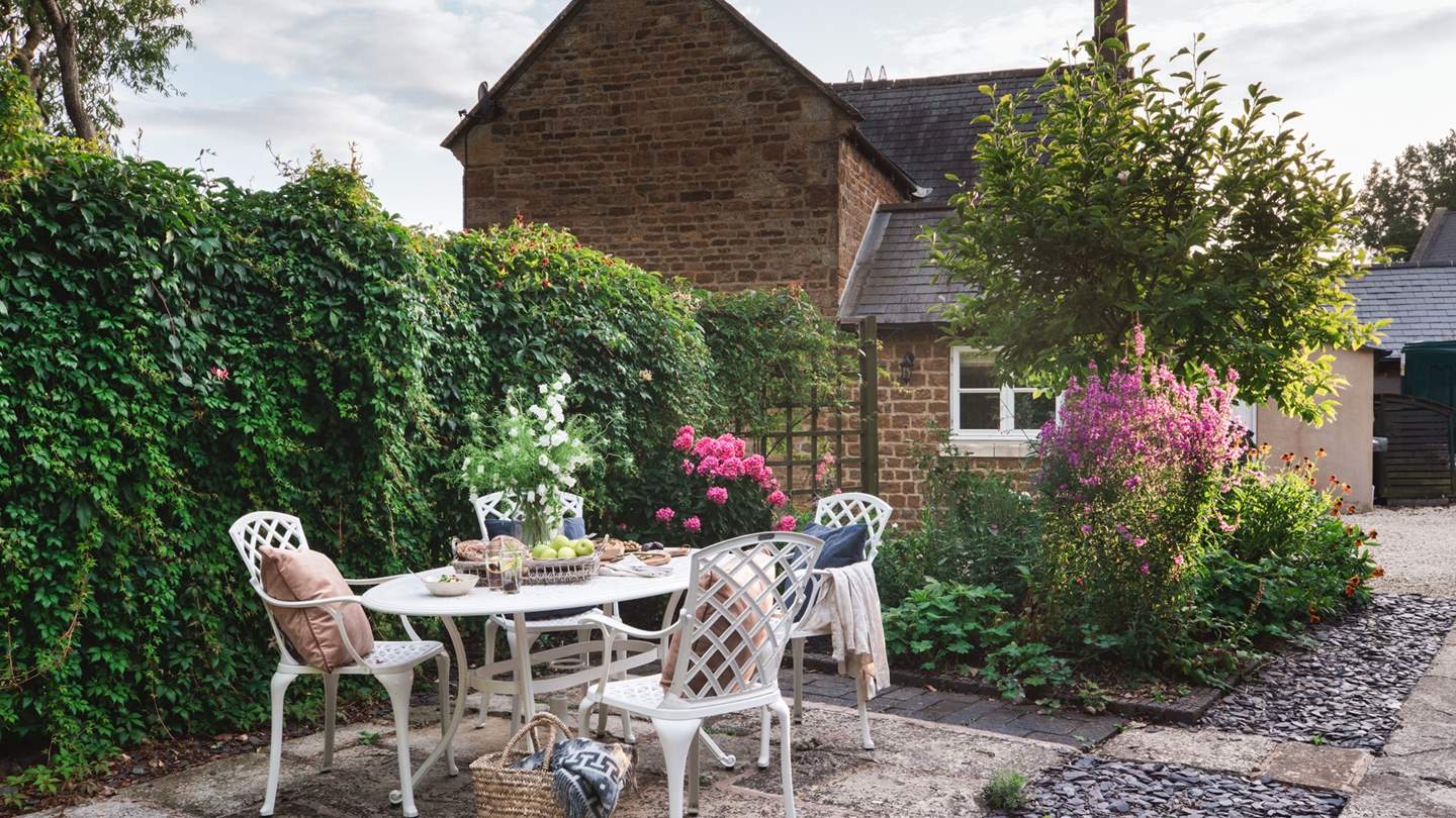 Outside, there's plenty of space in which to relax, such as here for a spot of alfresco dining