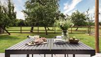 Meals alfresco are simply idyllic with sigh-inducing views over the orchard