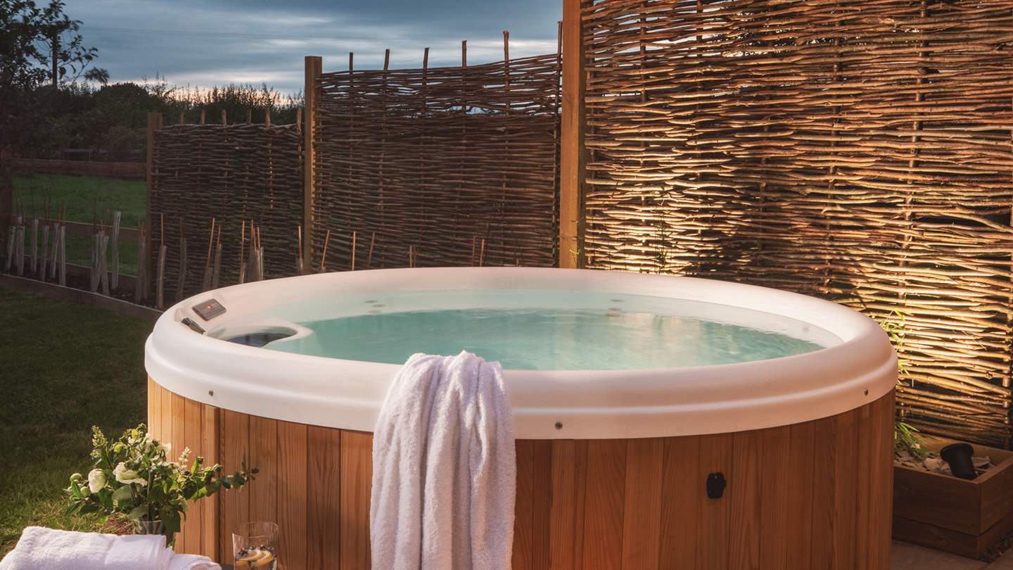 The delightful hot tub is just a dream, perfect for star gazing when the sun sets