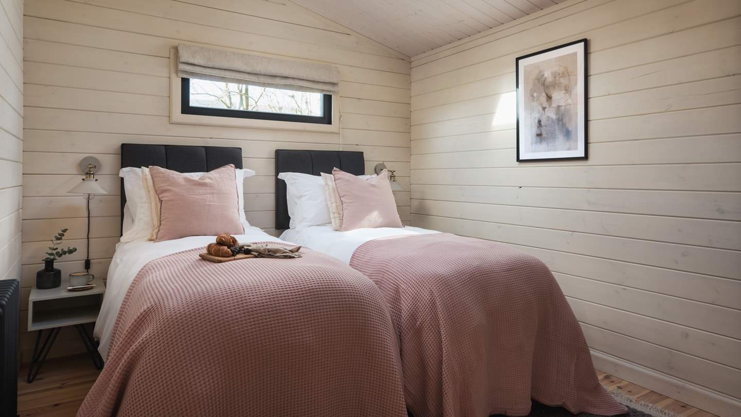 With wood-clad walls and floors, both bedrooms have everything you could need to make your stay comfortable...
