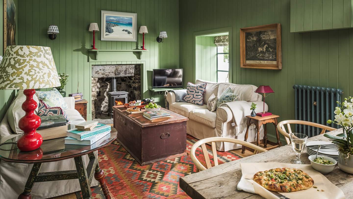The oh-so-cosy living space with flickering wood burner is the perfect spot to tuck yourself away...