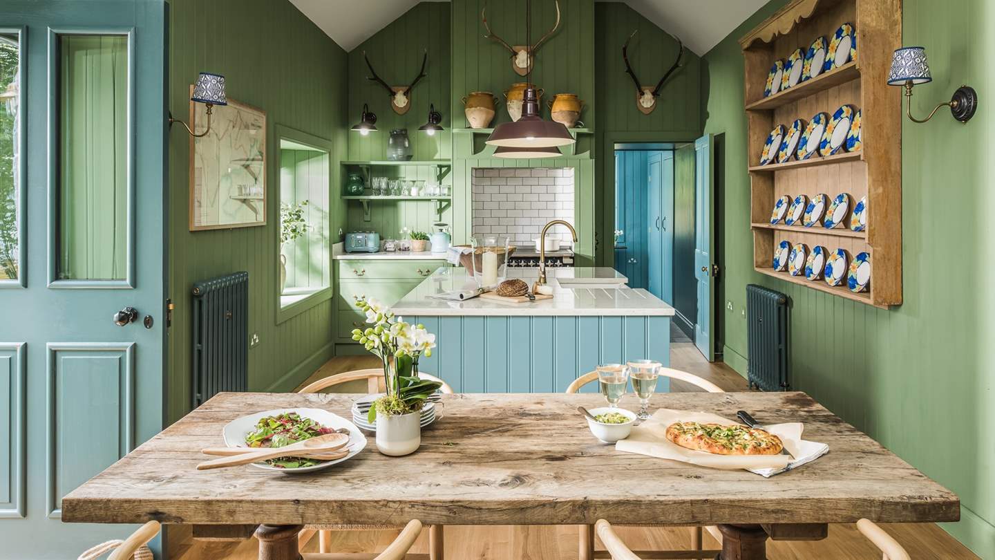 The fabulous wooden dining table - the setting for memorable meals and fantastic feasts