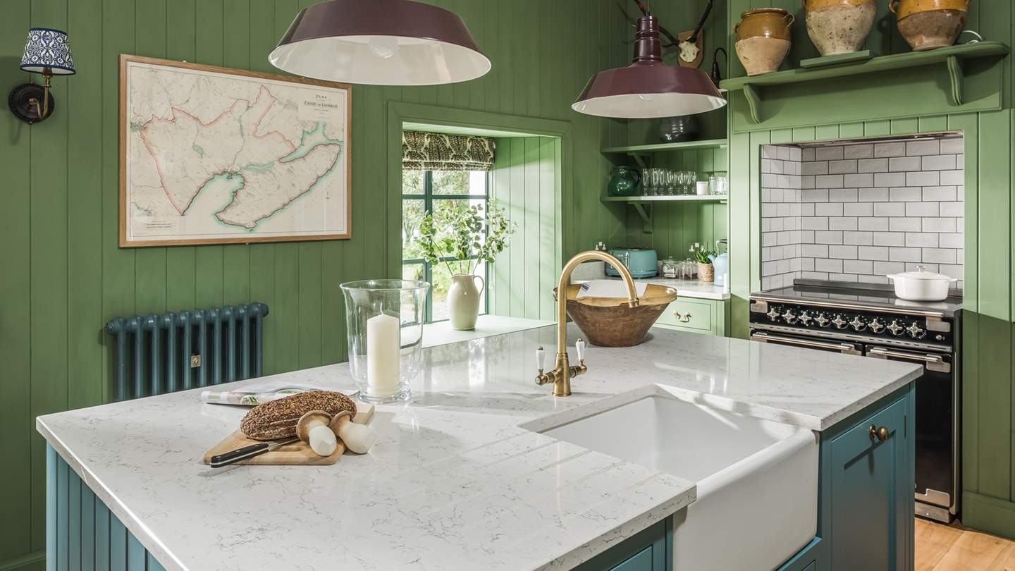 The kitchen complete with a Rangemaster electric cooker, large central island with Butler sink and all the other essentials