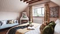 We adore the beautiful, vaulted ceiling and French inspired king size bed...