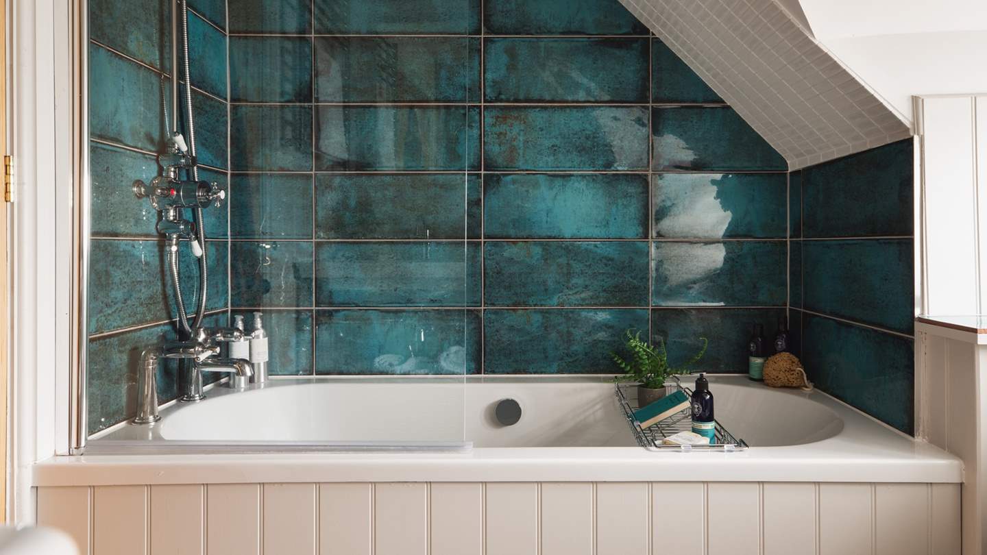 Dreamy bathtub moments await in the elegant tub...