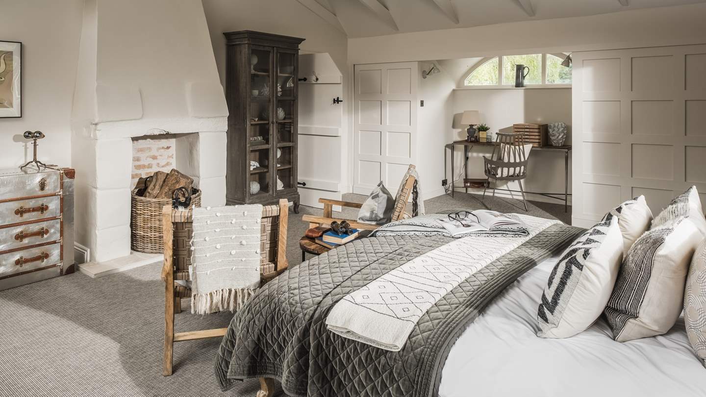 Dressed in a chic Scandi-style beneath the spellbinding vaulted ceiling, this bedroom is a truly stunning space to unwind at the end of the day