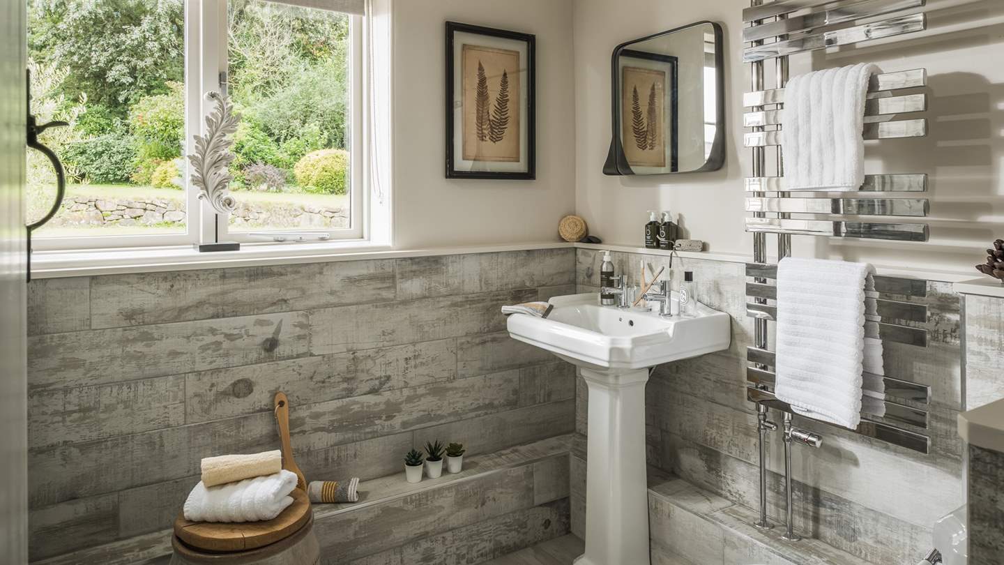 There's a family bathroom downstairs featuring a walk-in shower