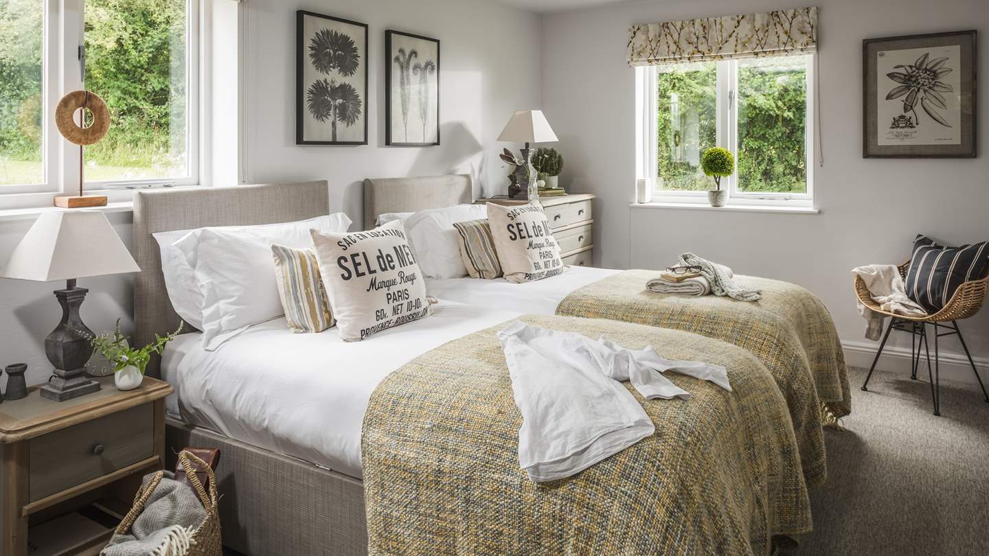 Bedrooms two and three lie downstairs, both offering the option of being set up as super kings or twin beds