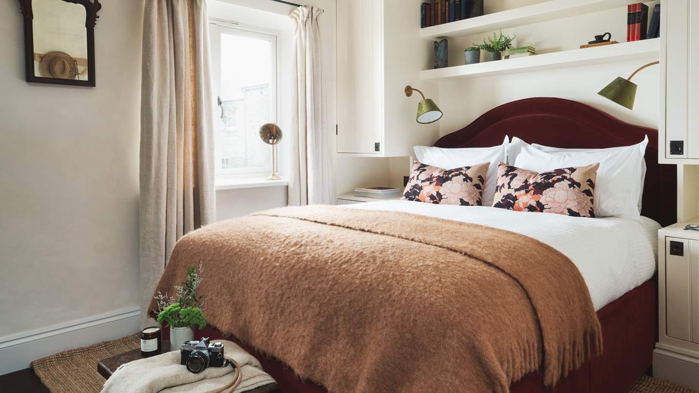 The king-size bed is tucked away in its own recess - just lovely!