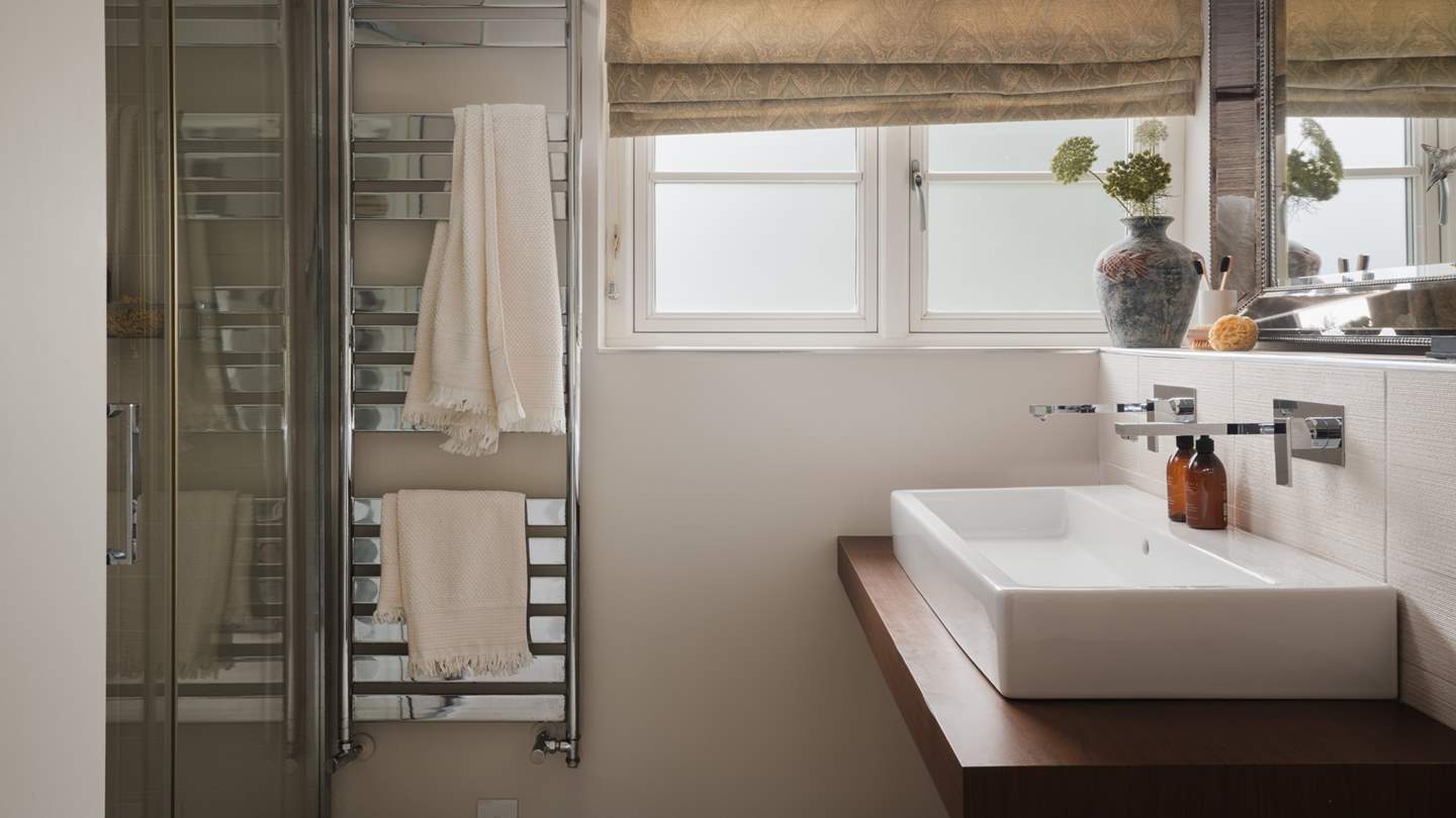 A heated towel rails to keep towels warm and fluffy