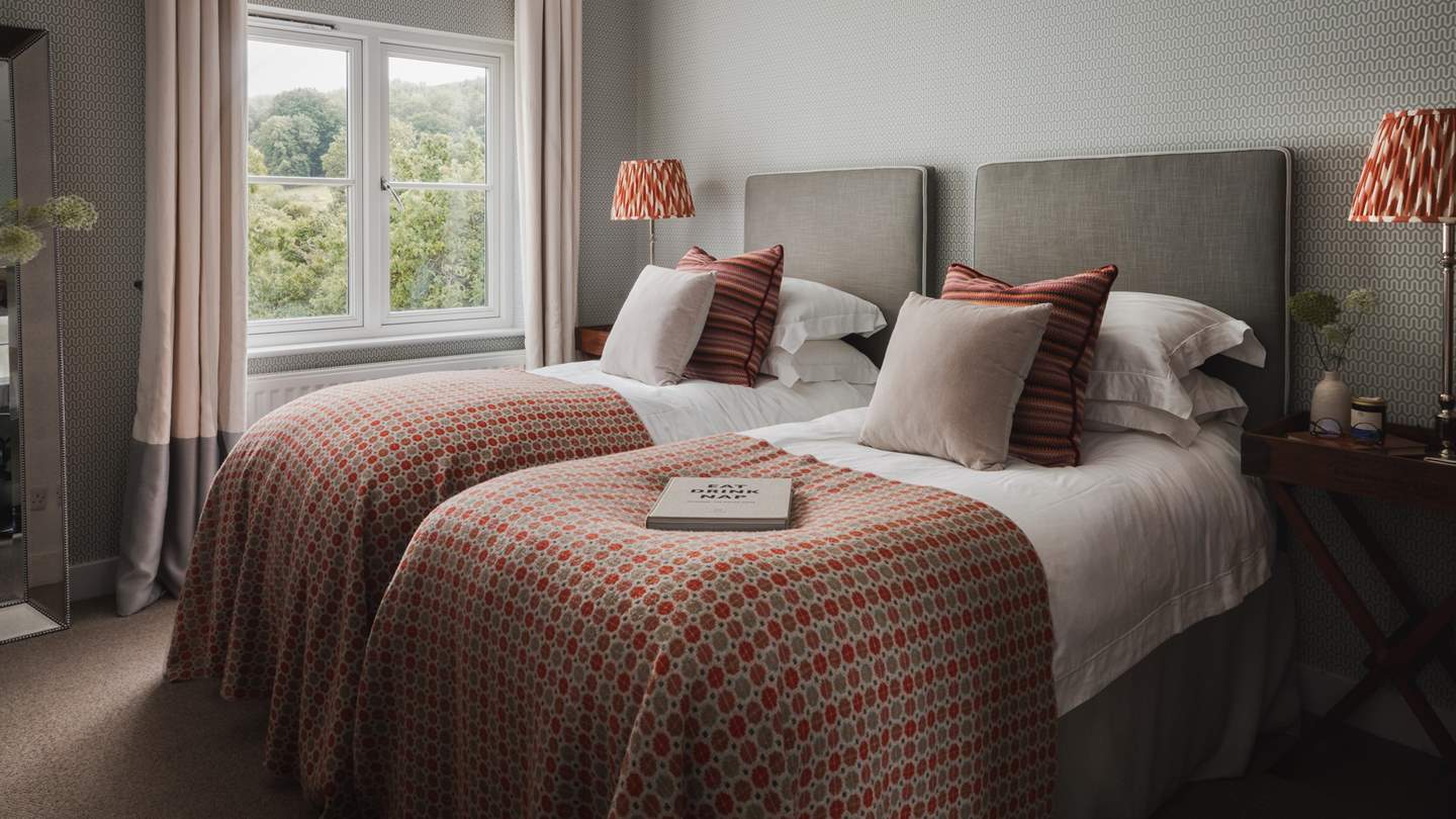 Bedroom four is an adorable twin room with twin beds and antique furnishings