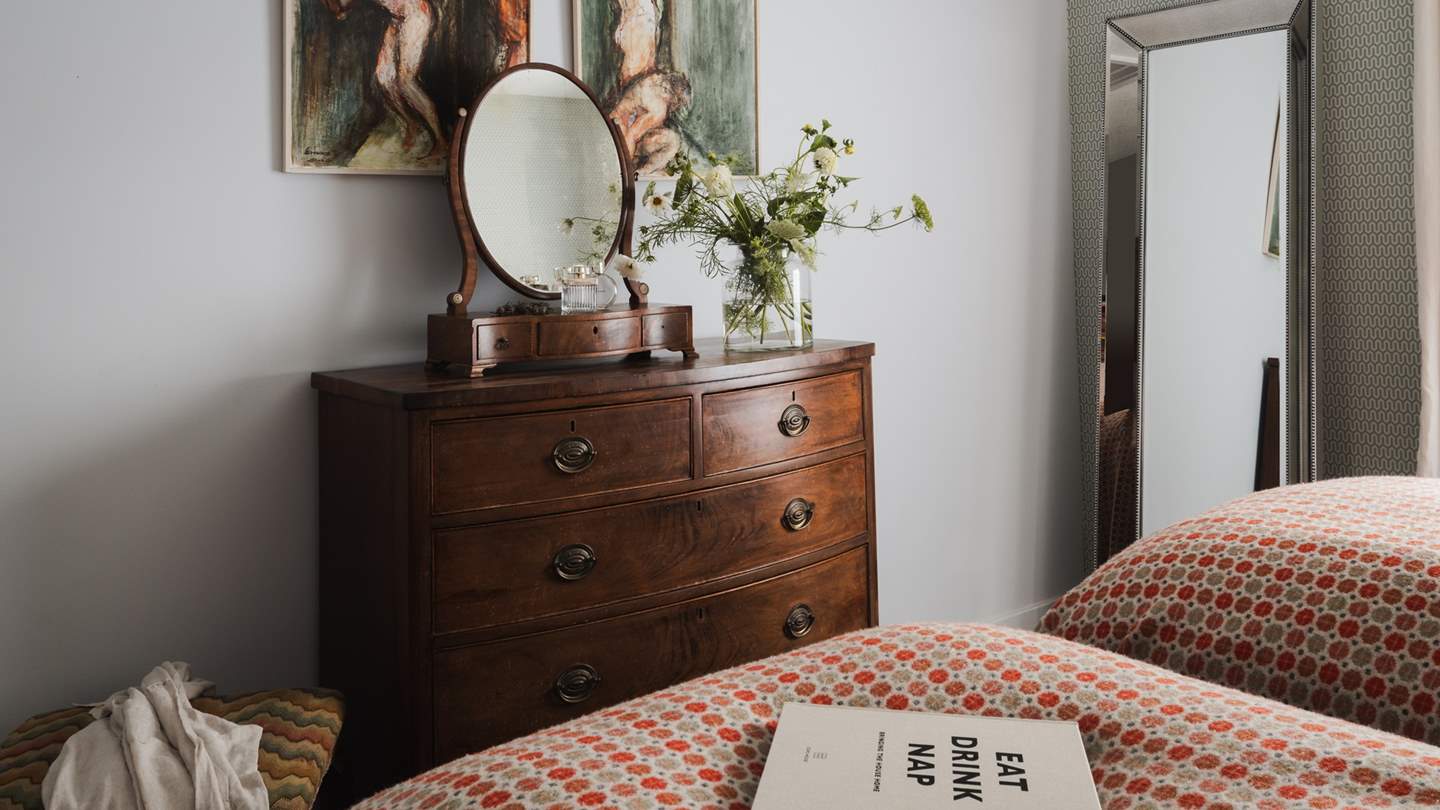 We adore the rich colours and dark woods, creating a warming space 