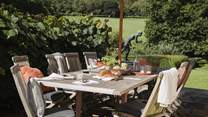  On the stone terrace you'll also find a charcoal Weber BBQ and a wonderful table seating twelve