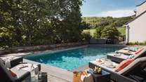This extraordinary retreat is the ultimate spot to unwind, with a spectacular, heated swimming pool 