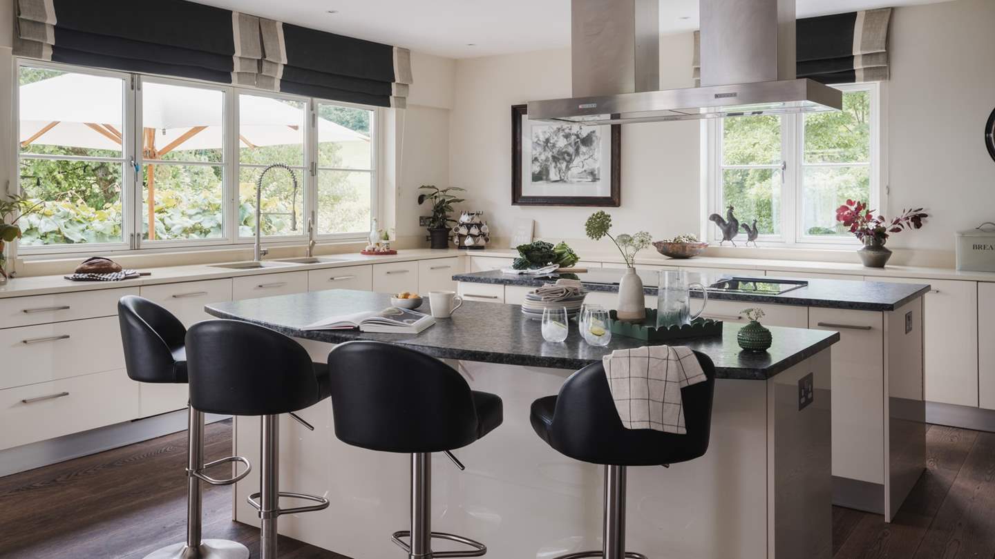 Spacious and sleek, the open-plan kitchen design is stunning