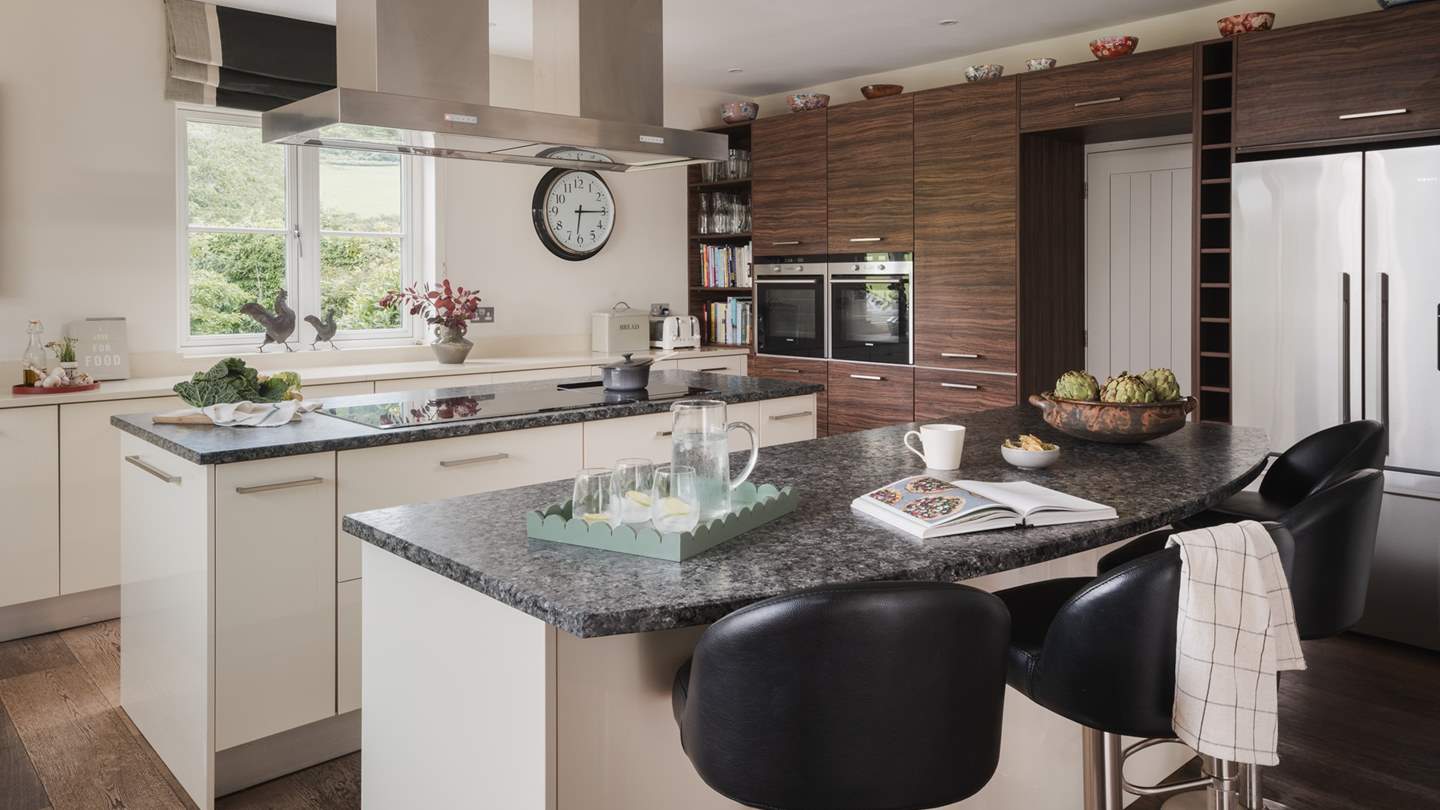 The modern open-plan kitchen and dining space is at the very heart of this homestay