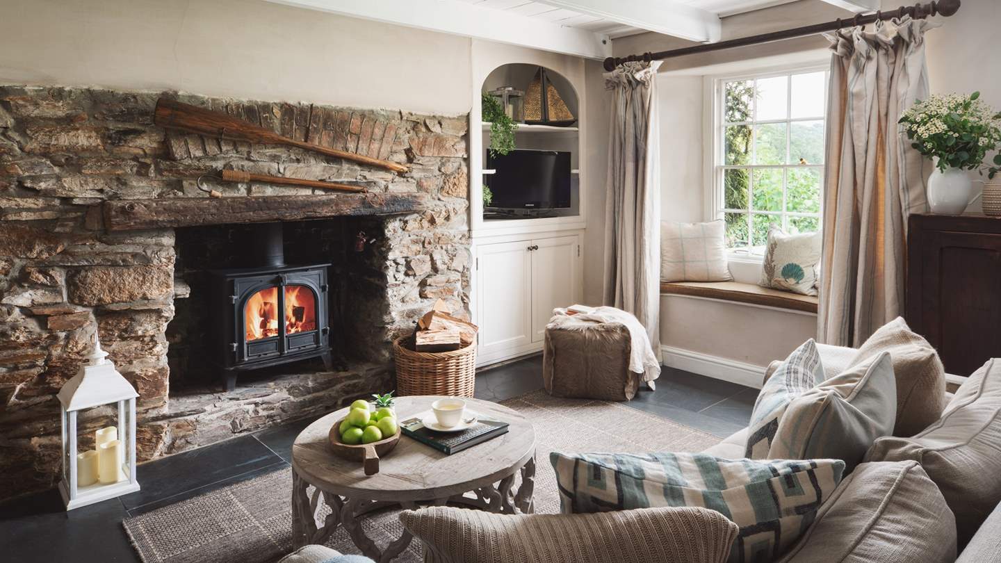 Settle in for cosy cottage moments beside the charming fireplace...