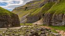 A hidden gem in the Yorkshire Dales, Gordale Scar is a huge limestone ravine home to 330ft high cliffs and two thunderous waterfalls
