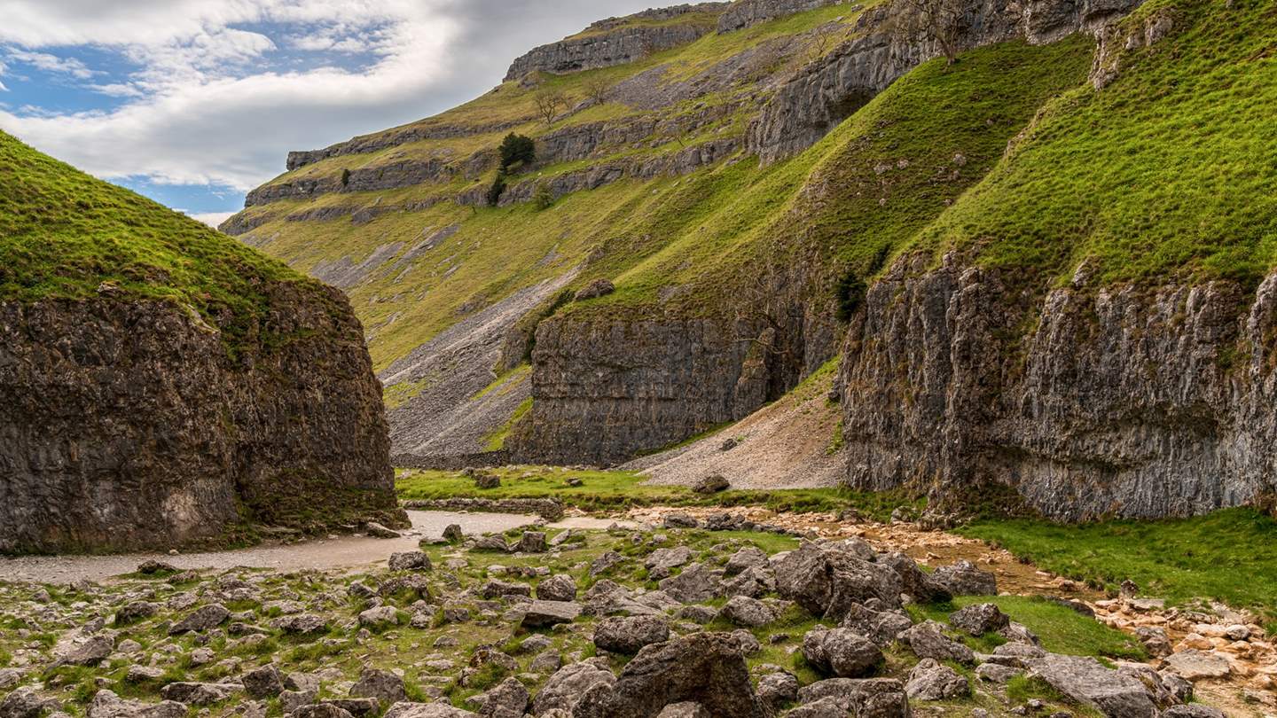 A hidden gem in the Yorkshire Dales, Gordale Scar is a huge limestone ravine home to 330ft high cliffs and two thunderous waterfalls