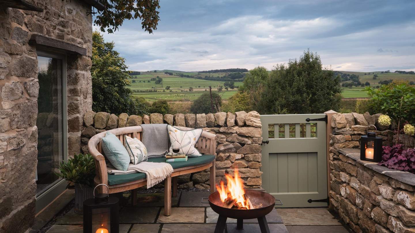 The fire pit also handily doubles up as a barbeque